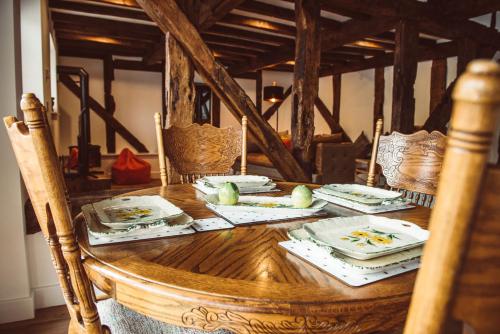 a wooden table with plates of food on it at Swallows Rest in Montgomery