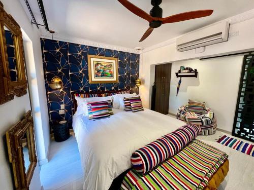 a bedroom with a bed and a ceiling fan at Forty 4 On Hoog in Polokwane