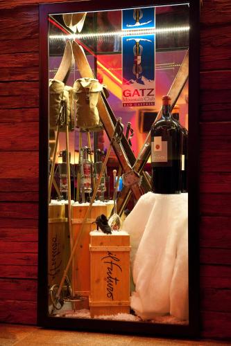 a framed picture of a bottle of wine on display at Hotel Gisela in Bad Gastein