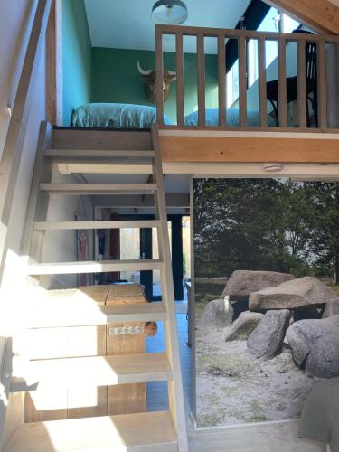 a loft bed in a room with a staircase at B&B Stoet & Berre Geheel privé 1 - 4 pers in Assen