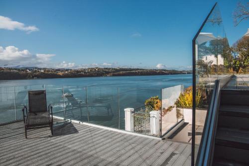 a balcony with a view of the water at The Ridge in Menai Bridge