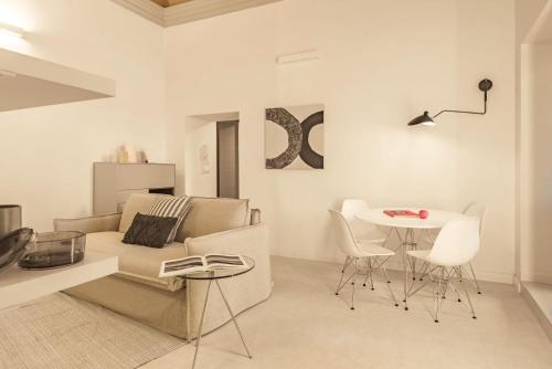 a living room with a couch and a table at CA'DUPELLE in Loano