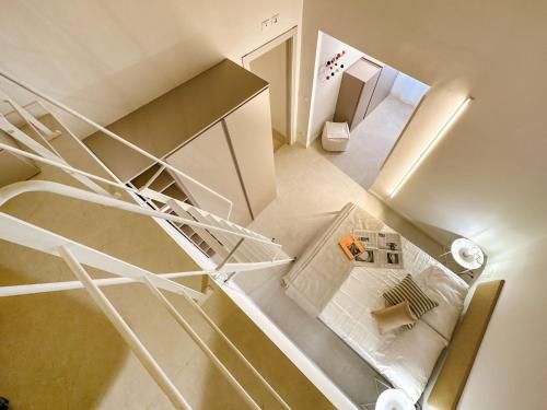 an overhead view of a spiral staircase in a room at CA'DUPELLE in Loano