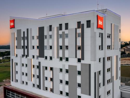 a rendering of a building with the nhs signs on it at Ibis Aruja in Arujá