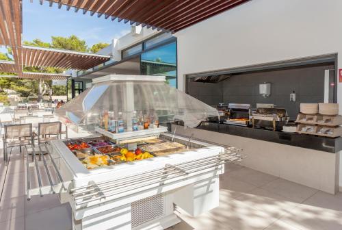 a food court with a buffet of food at Sun Club El Dorado - All Inclusive in Llucmajor