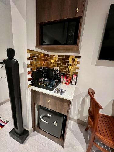 a kitchen with a stove and a counter top at Forty 4 On Hoog in Polokwane