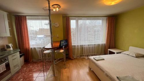 Llit o llits en una habitació de Green Riga studio