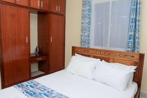 A bed or beds in a room at Bamburi Vescon 1 Luxury Apartments