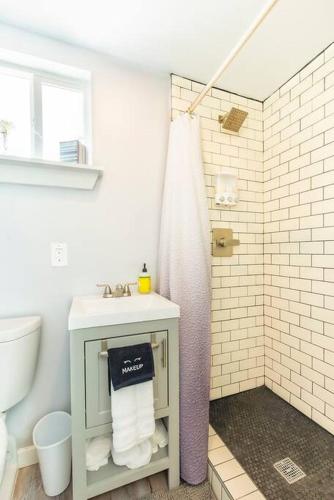 a bathroom with a sink and a shower at The Container Retreat @ 290 Wine Trail #8 Celebrate! in Hye