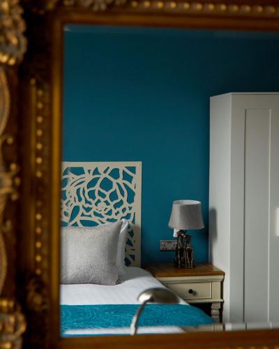 Ένα ή περισσότερα κρεβάτια σε δωμάτιο στο The Christopher Hotel, Eton