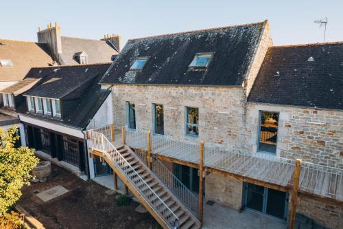 an aerial view of an old brick house with a deck at Bigouden Makers in Pont-lʼAbbé