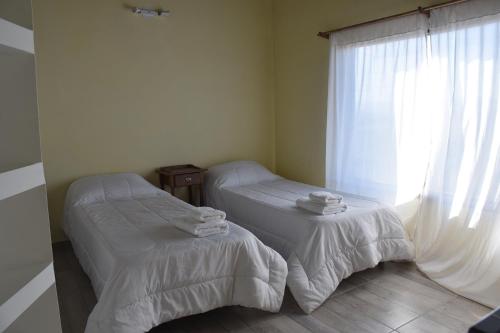 Una cama o camas en una habitación de Cedro Azul,casa loft