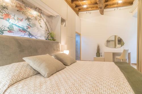 Postel nebo postele na pokoji v ubytování Tuscus Apartments