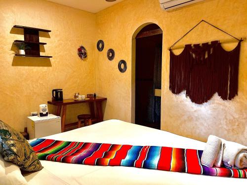 Postel nebo postele na pokoji v ubytování Pacha Tulum Boutique Hotel