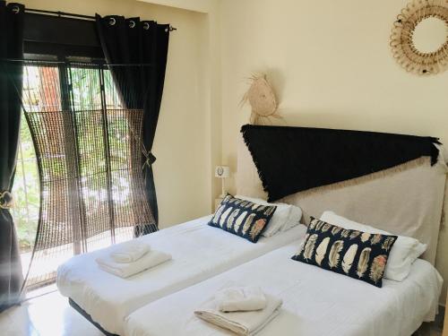 A bed or beds in a room at Dream Apartment in Estepona, Andalusia