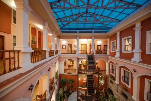 an image of therium of a building with a glass ceiling at Hotel Patio Andaluz in Quito