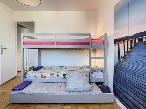 Ένα ή περισσότερα κρεβάτια σε δωμάτιο στο Appart Crystal Lyon Caluire et parkings