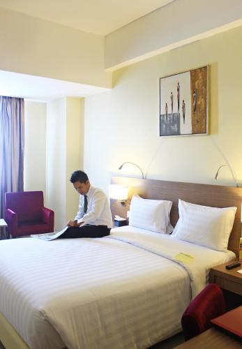 Katil atau katil-katil dalam bilik di Biz Hotel Batam