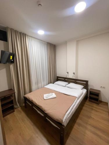 Postel nebo postele na pokoji v ubytování ART family hotel