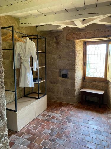 a room with a mannequin on a shelf in a building at Castle in the beautiful French countryside with all modern comfort in Terrou