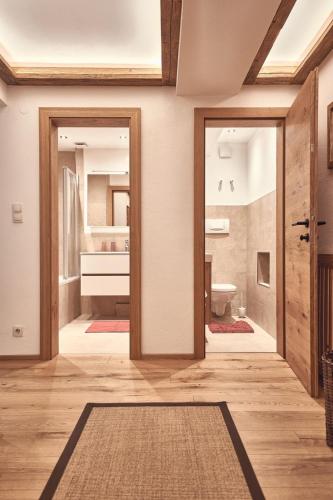 a hallway with two doors and a bathroom at Haus Josef-Herold-Straße 17a in Kitzbühel