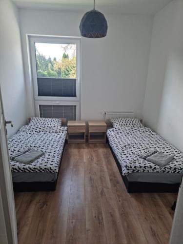 Ένα ή περισσότερα κρεβάτια σε δωμάτιο στο Apartament Oporowska 22