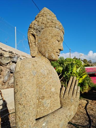 a statue of a woman holding her hands at FINCA BEROLO 1 in Guía de Isora