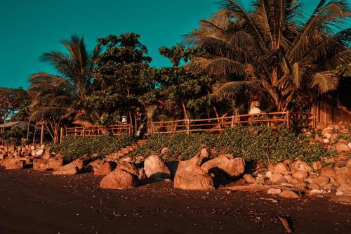 a pile of rocks on the side of a road at El Marabu Chill'n Surf in Aposentillo