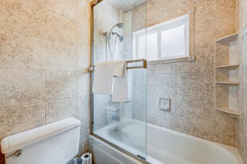 a bathroom with a shower and a tub and a toilet at Lake Tahoe Retreat in Incline Village