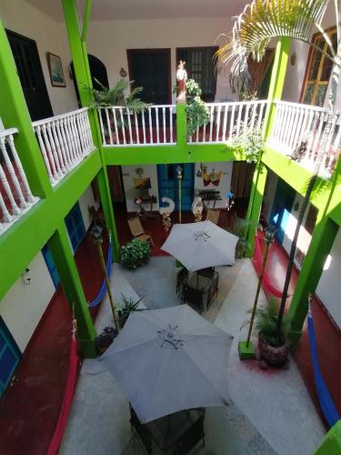 an overhead view of a patio with tables and umbrellas at Hostel La Casona 1859 in Guaduas