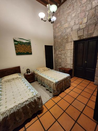 Ліжко або ліжка в номері Casa monarca