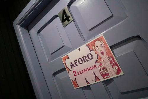 a sticker on a door with a sign on it at Motel ruta slavic in Punta Arenas