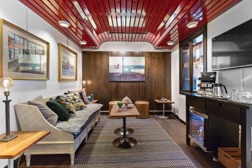 a living room with a couch and a table at Best Western Hotell Hudik in Hudiksvall