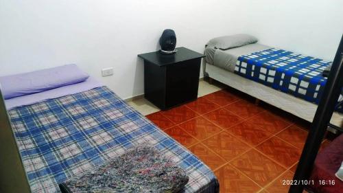 Postel nebo postele na pokoji v ubytování Hostal Lo de Ramona
