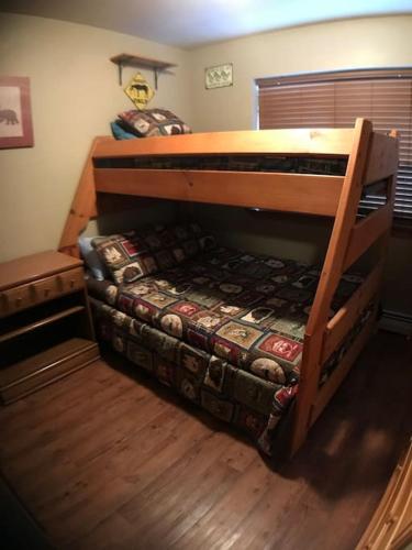 a bunk bed in a room with a bunk bedutenewayewayangering at Rustic 2 BR Mountain View-walk to resort in Big Sky
