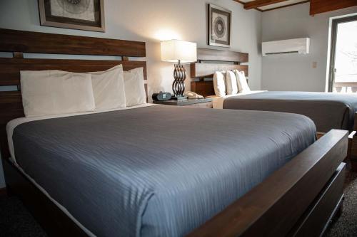 Postel nebo postele na pokoji v ubytování Hotel Vienna