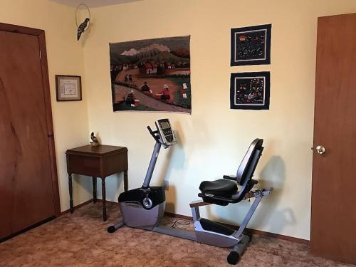a room with two exercise bikes and a desk at Foothill Acres in Midpines