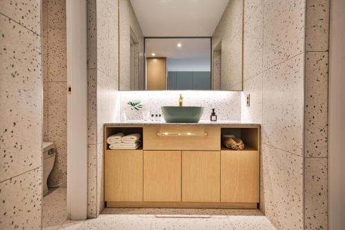 a bathroom with a sink and a mirror at Browndot Terrace Pohang Passenger Terminal in Pohang