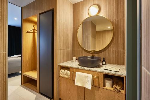 a bathroom with a sink and a mirror at Browndot Terrace Pohang Passenger Terminal in Pohang