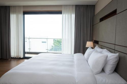 Katil atau katil-katil dalam bilik di Velum Resort
