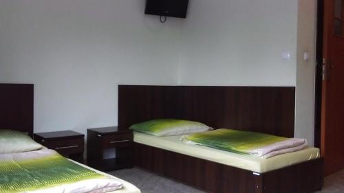 Ένα ή περισσότερα κρεβάτια σε δωμάτιο στο BOSiR Białogard