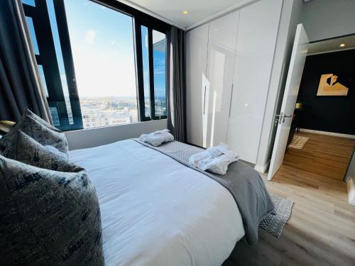 Letto o letti in una camera di Urban Elephant 16 On Bree