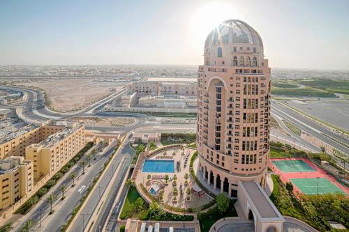 an overhead view of a tall building in a city at Al Gassar Resort in Doha