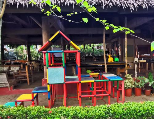a set of colorful play equipment in a yard at Sulu Sunset Beach Resort in Nauhang