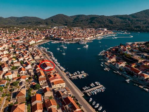 an aerial view of a harbor with boats in the water at Apartments & Rooms Fisherman's Luck in Vela Luka