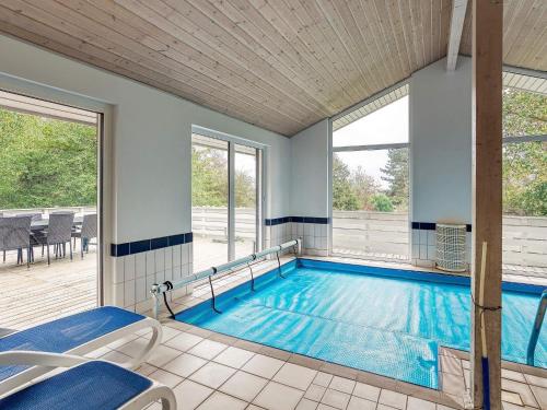 a swimming pool in a house at 12 person holiday home in Hundested-By Traum in Hundested