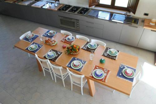 a table with plates of food on it in a kitchen at Vecchia Dimora Resort in Centuripe