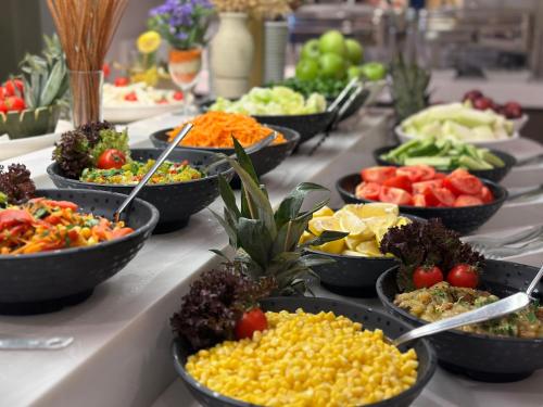 a buffet with many bowls of food on a table at AHC Old City Hotel in Istanbul