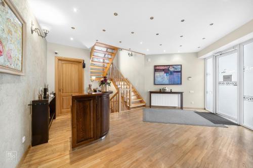 an empty living room with a staircase and a stair case at Senoji Palanga in Palanga