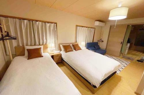 Un ou plusieurs lits dans un hébergement de l'établissement nearest Asakusa Ginza Skytree Ueno Nippori NRT Airport japanese house style